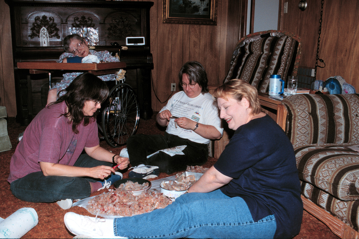 Sarah, Martha & Ellen shelling shrimp